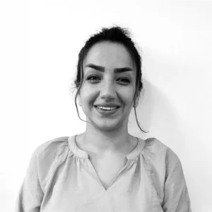 Corporate headshot of a TellusRem employee smiling in professional attire