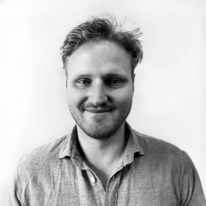 Corporate headshot of a TellusRem employee in a professional setting