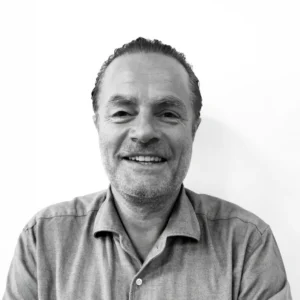 Corporate headshot of a TellusRem employee smiling in professional attire