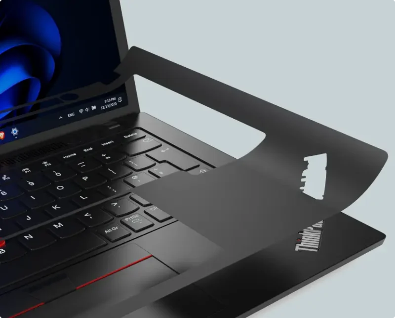 Laptop keyboard with stencil overlay showing keyboard reprinting process for refurbished devices